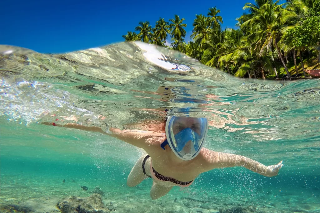 snorkeling-near-a-tropical-island-beautiful-girl-2021-08-26-19-00-30-utc-scaled